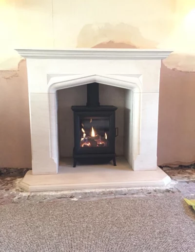 2646 Delamere Fireplace in limestone with Gazco Sheraton gas Stove